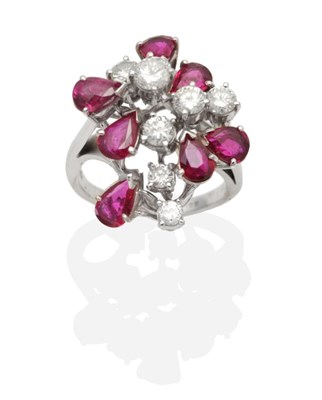 Lot 450 - An 18 Carat White Gold Diamond and Ruby Cluster Ring, round brilliant cut diamonds and pear cut...