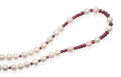 Lot 457 - A Ruby and Cultured Pearl Necklace, faceted ruby beads spaced at intervals by groups of...