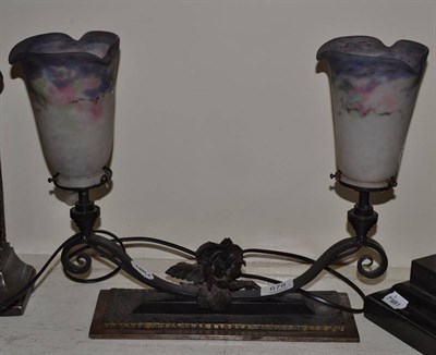 Lot 678 - A cast iron lamp with Muller Freres shades