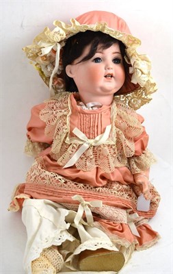 Lot 697 - An Armand Marseille 996 doll with remade dress made in the 1960's