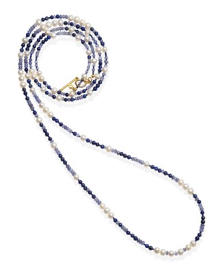 Lot 460 - A Tanzanite, Lapis Lazuli and Cultured Pearl Necklace, smooth and faceted tanzanite and lapis...