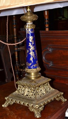 Lot 725 - Victorian brass and pottery table lamp