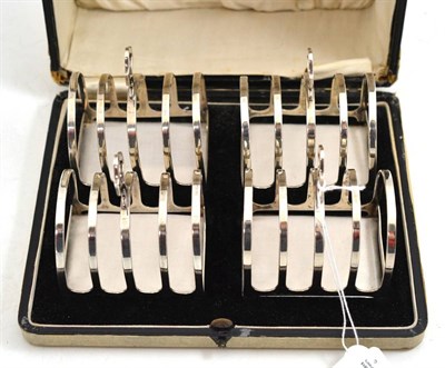 Lot 736 - Cased set of four silver toast racks