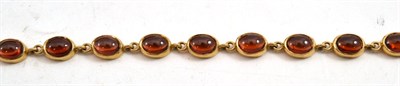 Lot 739 - A garnet cabochon set bracelet stamped 375