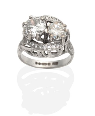 Lot 466 - An 18 Carat White Gold Diamond Ring, two round brilliant cut diamonds in claw settings, to...