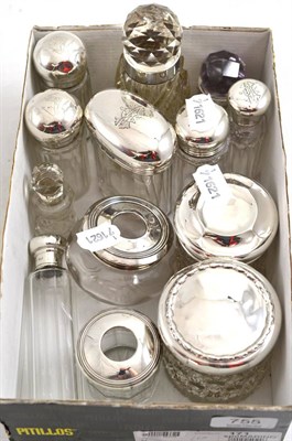 Lot 755 - Thirteen assorted cut glass toilet jars with silver mounts and covers