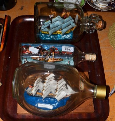 Lot 768 - Ships In Bottles: three sailing ships HMS Gloucester, Cutty Sark and another (3)