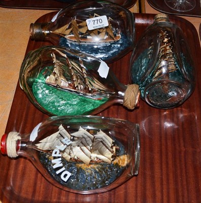 Lot 770 - Ships In Bottles: four three-masted sailing vessels (4)