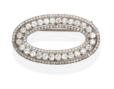 Lot 470 - An Art Deco Diamond Brooch, an oval hoop set throughout with three rows of old cut diamonds in...