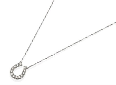 Lot 472 - A Diamond Horseshoe Pendant on Chain, set with graduated round brilliant cut diamonds in...