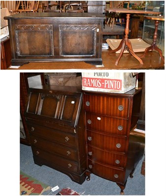 Lot 1010 - A reproduction carved oak blanket chest, an oak bureau, two occasional tables and a small chest...