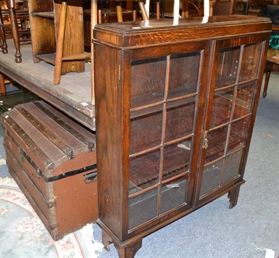 Lot 1024 - A display cabinet, trunk, travelling case, books and a travelling watch