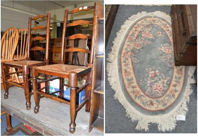 Lot 1027 - Pair of elm ladder back chairs with rush seats and a Chinese rug