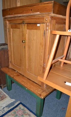 Lot 1030 - A Victorian pine two door cabinet (lacking back) and a pine coffee table with green painted legs