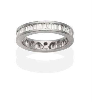 Lot 476 - A Diamond Eternity Ring, channel set baguette cut diamonds, total estimated diamond weight 1.65...