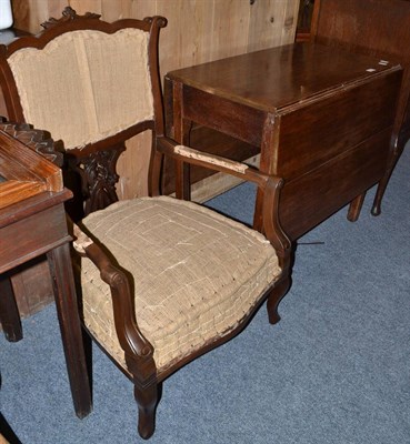 Lot 1057 - A 19th century oak drop leaf table and a mahogany elbow chair (2)