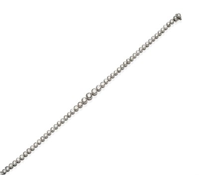 Lot 480 - A Diamond Line Bracelet, formed of graduated round brilliant cut diamonds in milgrain settings...