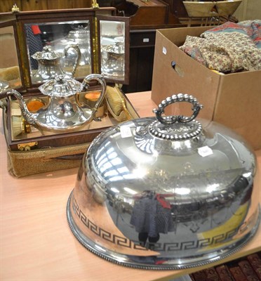 Lot 1068 - An electroplated meat dome, an Old Sheffield plate tea pot and a yellow enamel and gilt metal...