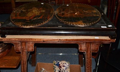 Lot 1091 - A Chinese ebonised hardwood stand, a Chinese table (lacking top) and two embossed and painted...