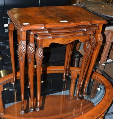 Lot 1095 - Walnut nest of three occasional tables