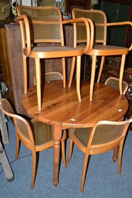 Lot 1110 - A modern pine circular table and six chairs