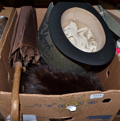 Lot 1174 - A black silk top hat, in card box; a bowler hat; a trilby; a pair of black silk lady's shoes; a fur