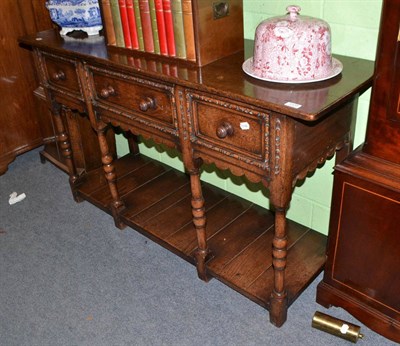 Lot 1338 - A reproduction oak sideboard