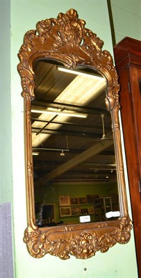 Lot 1342 - A gilt framed Rococo style mirror