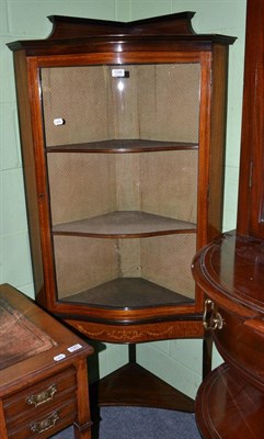 Lot 1346 - An Edwardian mahogany inlaid and ebonised glazed standing corner cabinet