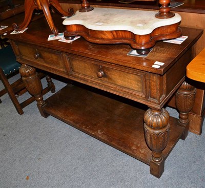 Lot 1356 - An oak sideboard containing a part silver canteen of cutlery (with key)