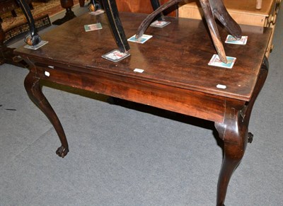 Lot 1365 - A 19th century mahogany table on claw and ball feet