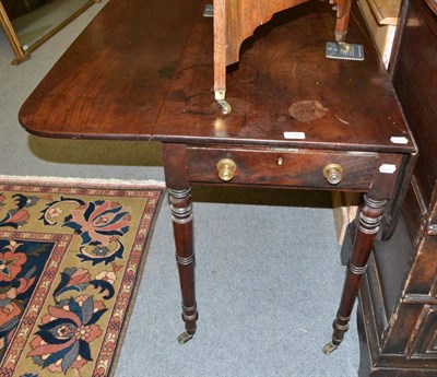 Lot 1372 - A 19th century mahogany drop leaf table