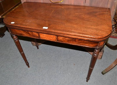 Lot 1375 - A 19th century mahogany fold-over tea table