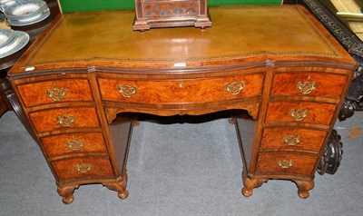 Lot 1382 - Walnut desk with leather top