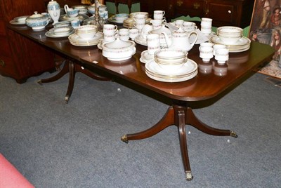 Lot 1383 - A Regency style mahogany dining table