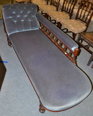 Lot 1395 - A Victorian mahogany chaise longue with blue velvet upholstery