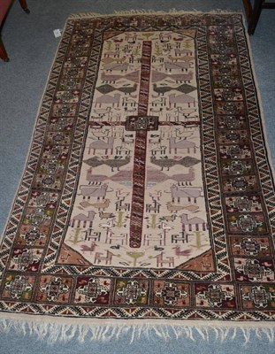 Lot 1397 - A piled and flat woven Afghan rug, the pale mushroom field of stylised zoomorphic work enclosed...