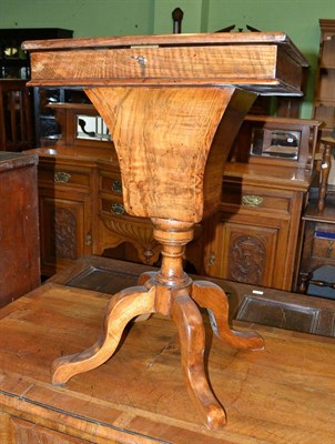 Lot 1422 - A Victorian walnut sewing table (associated and restored)