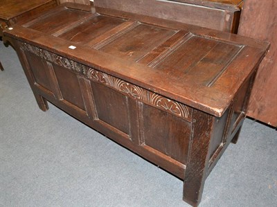 Lot 1429 - A late 18th century carved oak blanket chest