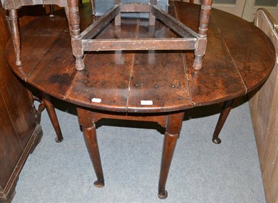 Lot 1432 - A 17th/18th century oak pad foot gateleg table