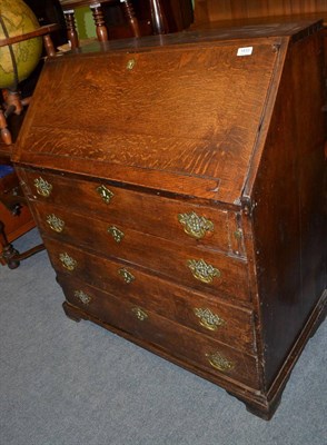 Lot 1433 - A Georgian oak bureau