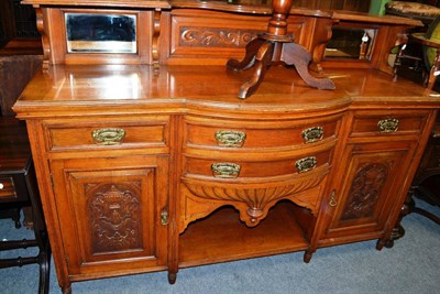 Lot 1436 - A late Victorian oak mirror back sideboard with carved panels