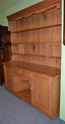 Lot 1447 - A large pine dresser with later rack