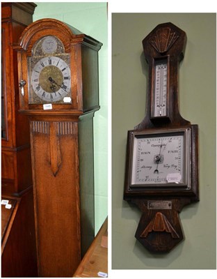 Lot 1448 - A small chiming longcase clock and a small aneroid barometer