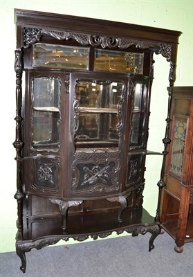 Lot 1451 - A late Victorian carved and ebonised display cabinet