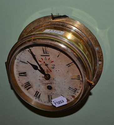 Lot 1473 - A ship's brass cased bulkhead wall clock