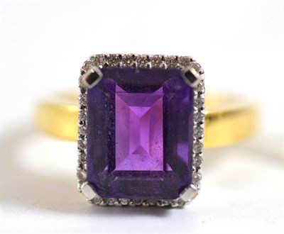 Lot 17 - An 18ct gold amethyst and diamond cluster ring
