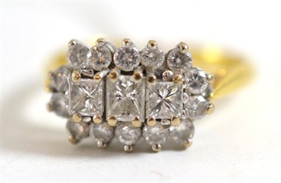 Lot 19 - An 18ct gold princess cut and round brilliant cut diamond triple cluster ring