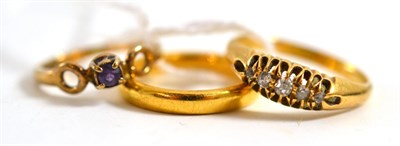 Lot 45 - A 22ct gold band ring, an 18ct gold diamond five stone ring (boxed) and a 9ct gold ring (3)