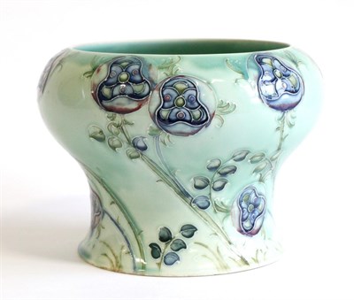 Lot 570 - William Moorcroft (British, 1872-1945): for Liberty & Co, A Tudor Rose Pattern Vase, on a jade...